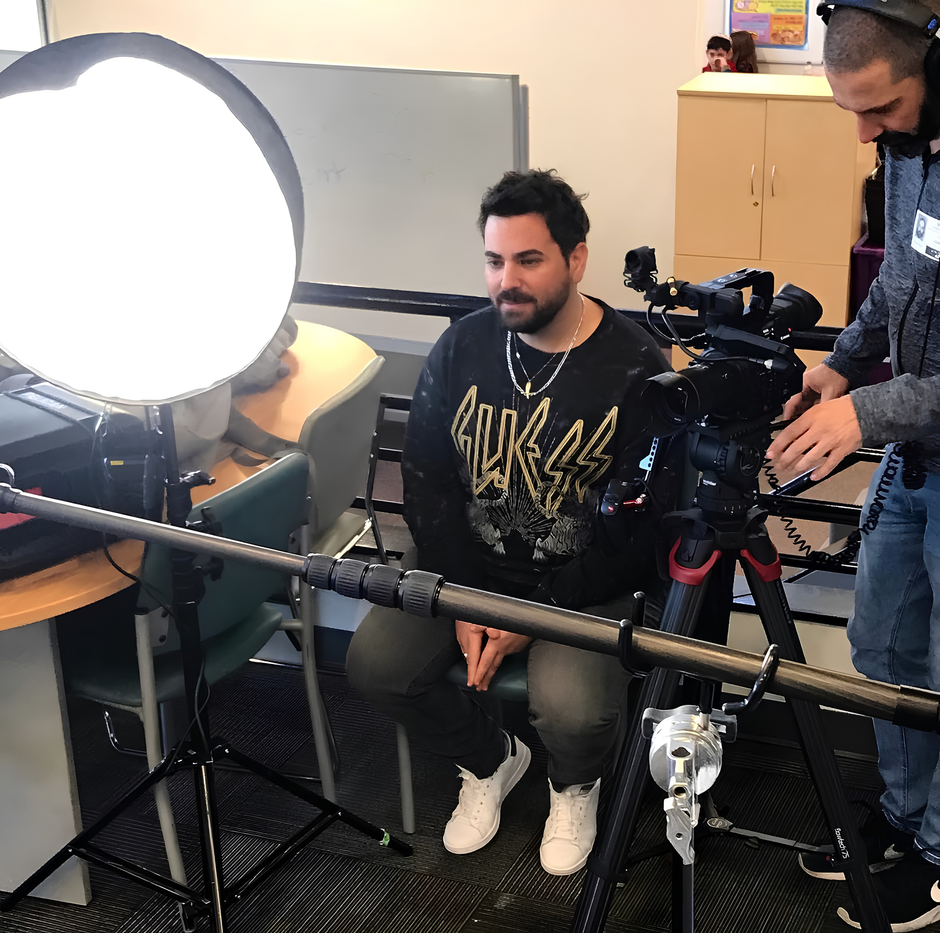 Eyal Berger working with a camera crew on set